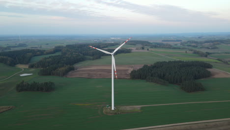 Windmills-Over-Beautiful-Green-Fields-In-Lubawa,-Poland---Aerial-Drone-Shot