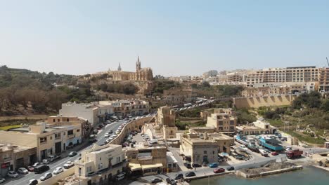 Aerial-Push-In-Shot-Towards-Church-of-the-Madonna-of-Lourdes-in-Gozo-Malta