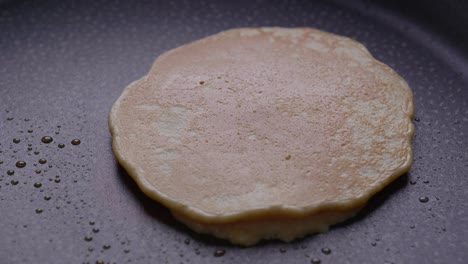 Turning-a-pancake-over-while-cooking-breakfast