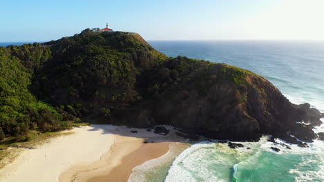 Wide-revealing-drone-shot-of-Cape-Byron-Lighthouse,-Australia