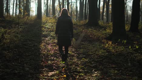 Woman-Walking-Alone-In-The-Forest