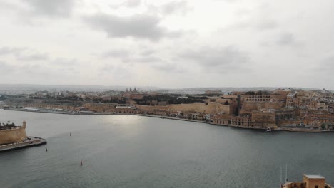 Panoramic-from-the-Three-Cities-over-the-Grand-Harbor-overlooking-Valletta,-the-capital-city-of-Malta---Aerial-shot