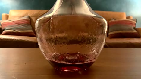 Red-wine-slowly-poured-into-carafe