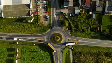 Aerial-top-down-of-traffic-in-roundabout-during-sunny-day