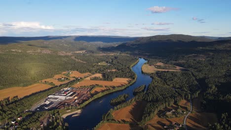 Drone-footage-of-mountains,valley-and-river-and-a-small-town-in-Southern-Norway