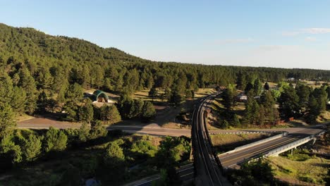 A-reverse-drone-shot-over-railroad-trestles-in-a-rural-Colorado-town