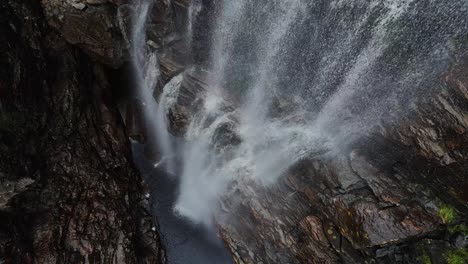 Steady-drone-footage-at-the-bottom-of-a-waterfall