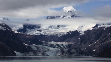 Johns-Hopkins-Glacier-and-the-snow-capped-mountains-around-it-and-clouds