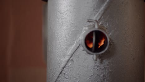 Fire-In-a-Small-Silver-Steel-Wood-Burning-Stove-Close-Up