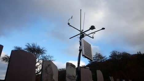 Weather-forecasting-scientific-station-solar-panel-wind-sensor-under-blue-sky-dolly-low-angle-right