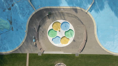 Top-down-aerial-of-deserted-outdoor-swimming-pool
