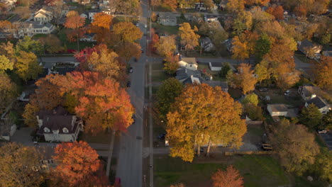 Aerial-view-of-a-car-driving-down-a-street-in-a-subdivision-of-Kirkwood-in-St