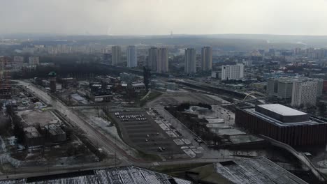 Flying-Towards-City-Center-Above-Parking-in-The-Winter-Katowice