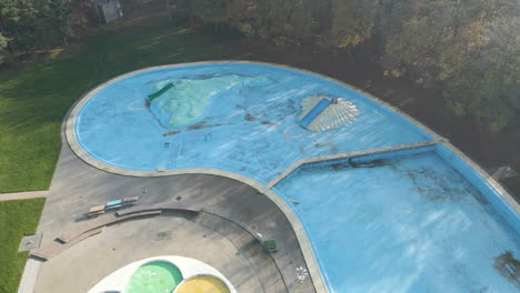 Low-aerial-of-deserted-outdoor-swimming-pool
