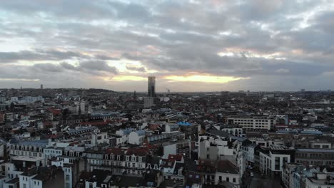 Aerial-panaromic-pan-from-left-to-right-view-flight-of-Brussels-city-on-cloudy-day,-Belgium