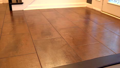 Big-flooring-tiles-installed-in-beautiful-home,-tiles-are-made-of-ceramic-material-and-with-reddish-textures