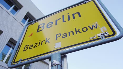 Slow-Motion-of-Berlin-Town-Sign-in-Pankow-District-under-Blue-Sky
