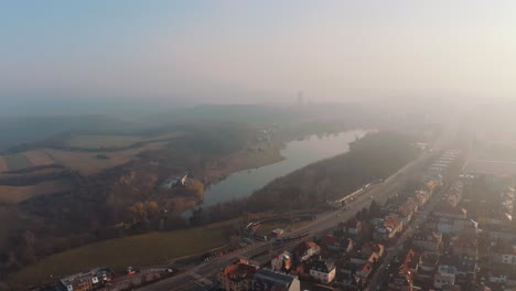 Amazing-aerial-drone-view-of-Prague-Sarka-lysolaje-national-park-Czechia,-misty-early-morning-day,-circle-pan