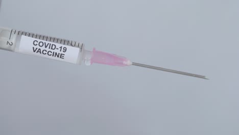 Uncapping-a-syringe-with-a-Corona-Virus-Vaccine--close-up