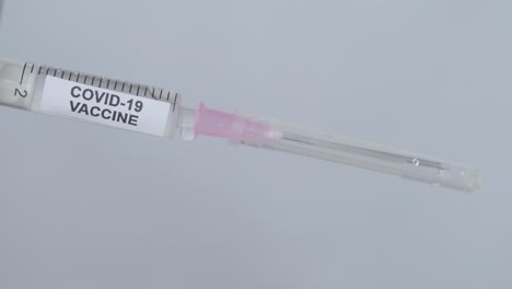 Hand-Of-A-Medic-With-Glove-Puts-Needle-On-The-Syringe-For-Corona-Virus-Vaccine,-Close-Up-Shot