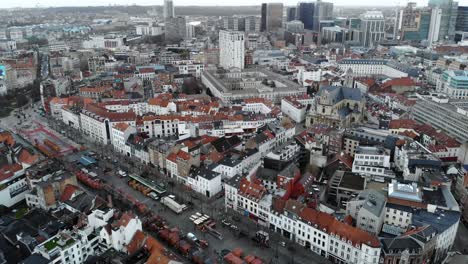Aerial-flight-over-Brussels-city's-buildings-and-streets,-Belgium