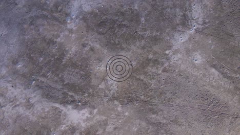 Circle-Target-on-Moon-like-Rock-Surface---Aerial-Drone-Overhead-View