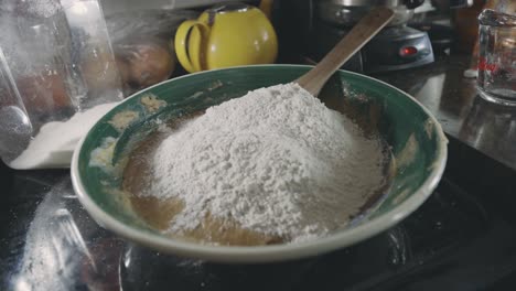 Adding-Flour-To-Cookie-Dough-Mixture-In-The-Kitchen---close-up