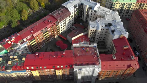 Aerial-view-of-colorful-buildings-forming-triangle-shaped-courtyard
