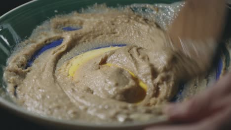 Mixing-Cookie-Batter-By-Hand-Using-A-Wooden-Spoon