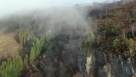 Aerial-View,-Morning-Fog-Above-Steep-Rocky-Cliffs-and-Autumn-Landscape-in-Rural-Norway