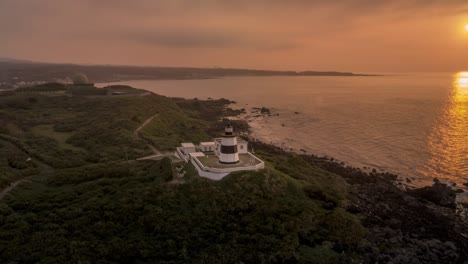 Drone-hyperlapse-of-a-lighthouse-during-a-beautiful-sunset