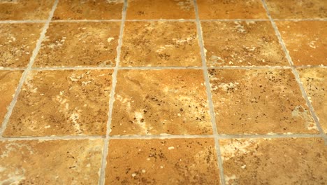 4k-shot-of-square-floor-tiles-installed-on-bathroom-floor