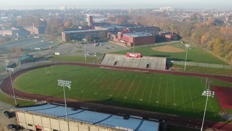 Aerial-of-track-and-field-of-college,-university-school-campus