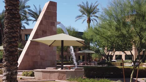 A-sight-title-up-from-ground-level-to-the-top-of-a-30-foot-brick-fountain,-Scottsdale,-Arizona