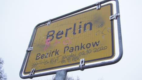 Dirty-Berlin-City-Sign-on-Cloudy-Day-in-Slow-Motion
