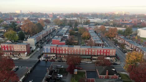 Aerial-establishing-shot-of-colorful-row-homes-in-city-of-Lancaster,-Pennsylvania-USA-during-autumn