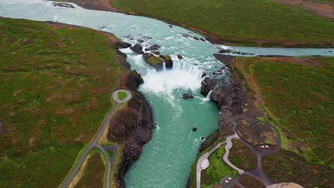 Pullback-cinematic-view-of-Godafoss-waterfall-cascades---North-Iceland---Diamond-Cirlcle---Aerial-4k