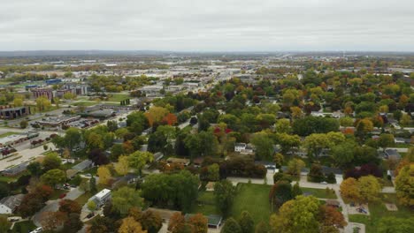 Drone-Flies-Backwards-Over-Suburban-Homes-with-Fall-Colors