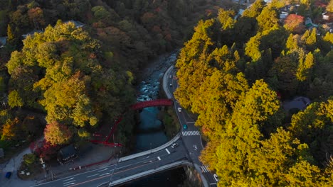 Slow-aerial-drone-forwards-over-Shinkyo-Bridge-in-Nikko-with-car-traffic
