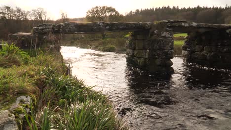 View-of-bridges-of-rough-stone-in-the-middle-of-the-national-park-in-the-English-country-side-with-a-stream-under-it