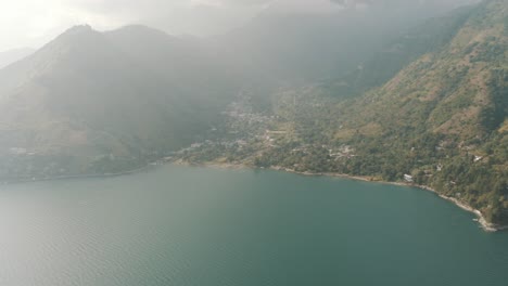 Drone-aerial-view-during-sunny-day-of-San-Marcos-la-Laguna,-Lake-Atitlan,-Guatemala