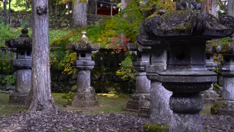 Beautiful-Japanese-stone-pillars-inside-Japanese-shrine-during-autumn-colors