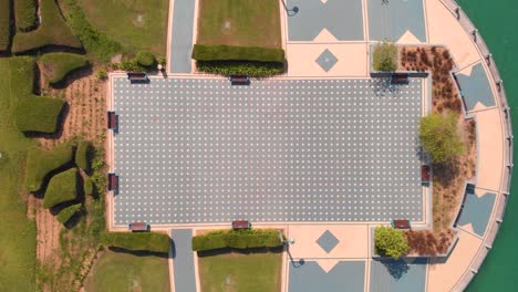 Aerial-shot-over-a-modern-square-with-a-bike-lane-near-the-water-in-Abu-Dhabi