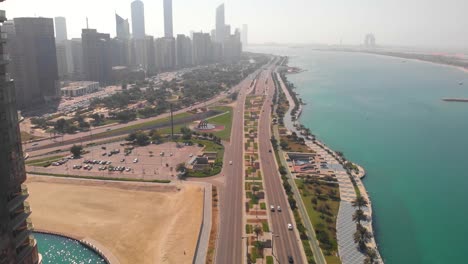 Aerial-tilt-down-shot-over-a-highway-in-Abu-Dhabi-near-the-coast