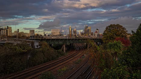 Timelapse-of-Inter-city-trains-in-front-of-London-skyscrapers-at-sunset
