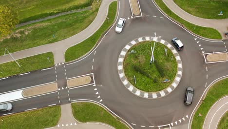 Aerial-View-Of-Cars-Driving-In-Roundabout-Road-At-Daytime