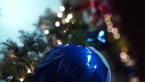 Christmas-Ball-with-lights-behind,-4k,-SonyAlpha