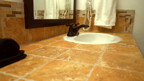 Beautiful-bathroom-interior-design-of-vanity-cabinet,-traditional-tile-countertop