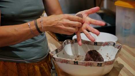Woman´s-hands-kneading-cookies,-taking-the-dough-from-a-bowl