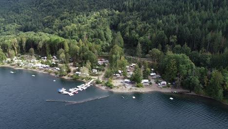 Aerial-View-of-a-Campground-and-Pier-by-Sproat-Lake,-Vancouver-Island